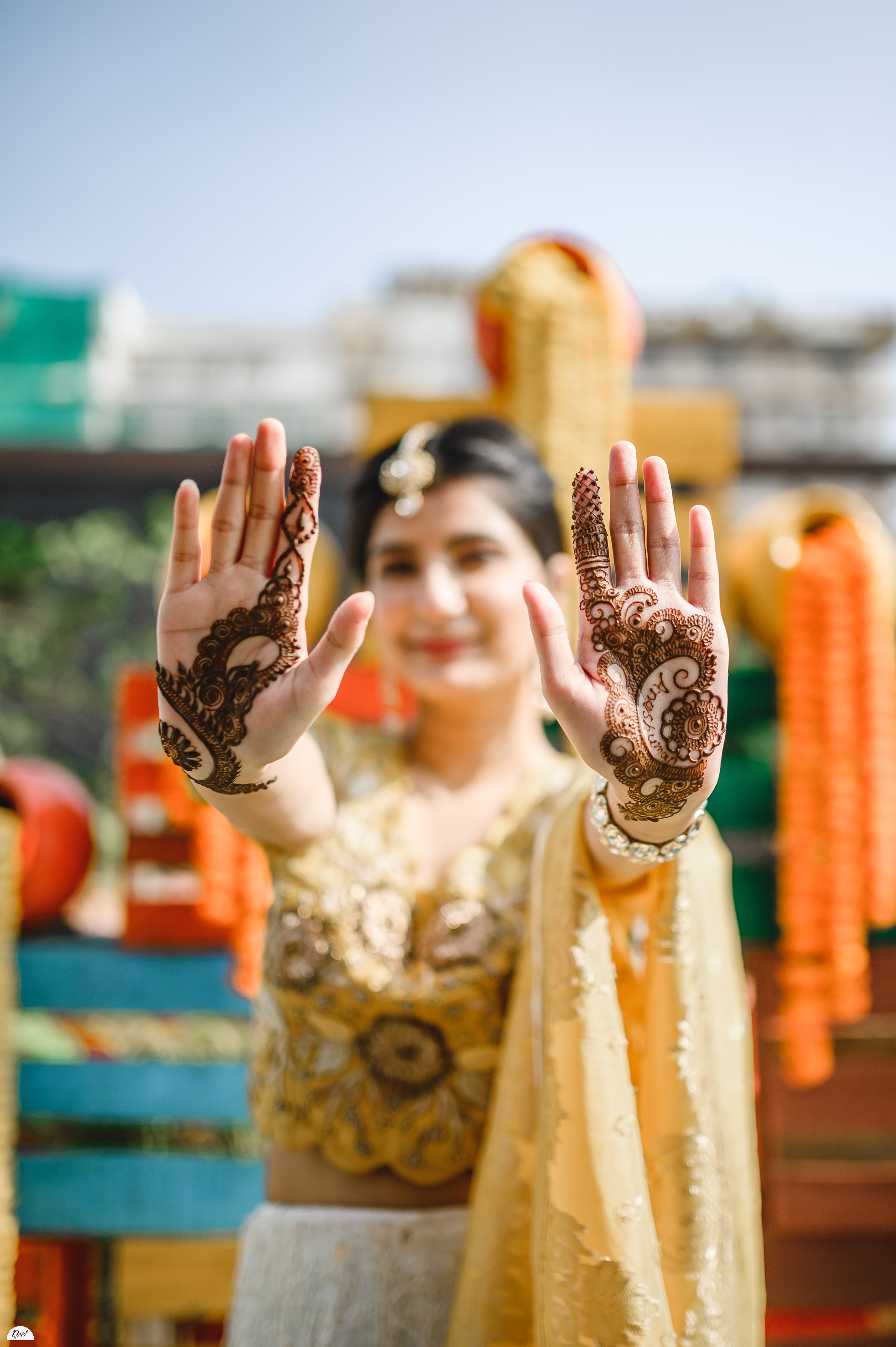 Lovely Indian bride and groom posing at the mehndi pre-wedding celebration.  | Photo 163358